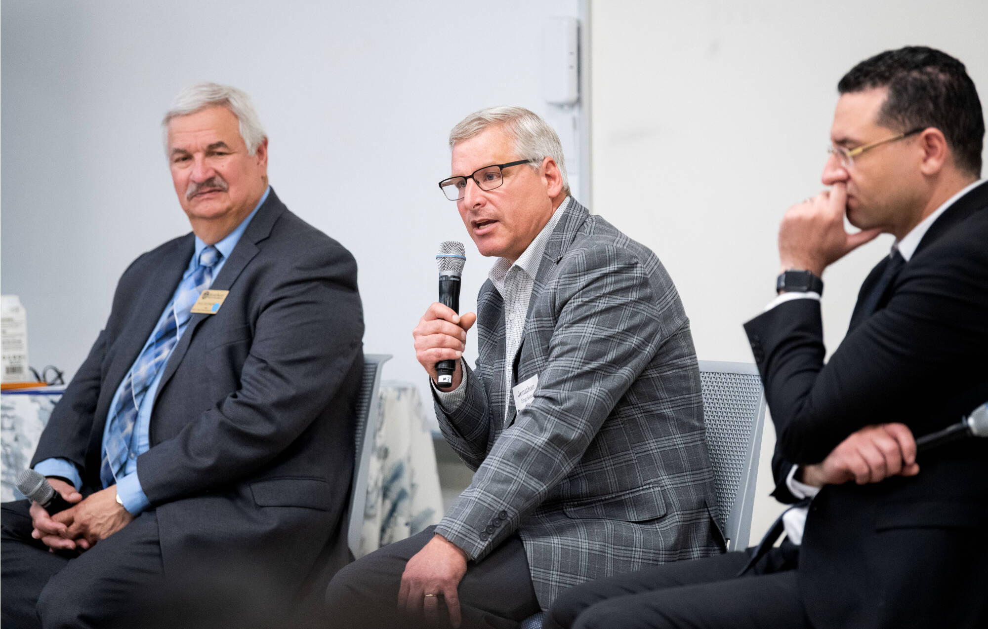 From left, panelists Paul Plotkowski, Jonathan Engelsma and Marouane Kessentini participate in a discussion to policy, economic, business and government leaders from numerous countries after touring the Shape Corp Innovation Design Center.